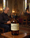 Bottle of Holy Anointing Oil on a table in a church setting