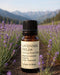 Bottle of Lavender Fields essential oil blend with a mountainous landscape in the background